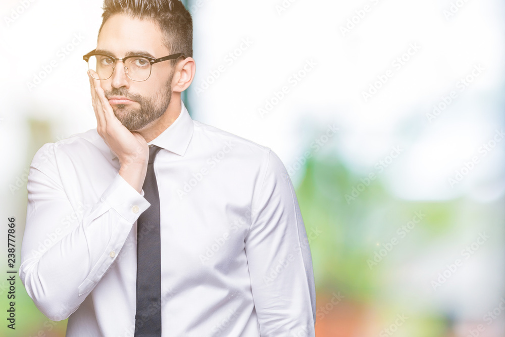 Young handsome business man wearing glasses over isolated background thinking looking tired and bored with depression problems with crossed arms. Young handsome business man wearing glasses over isolated background thinking looking tired and bored with depression problems with crossed arms.