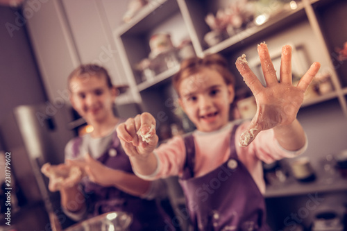 Selective focus of a hand in the dough