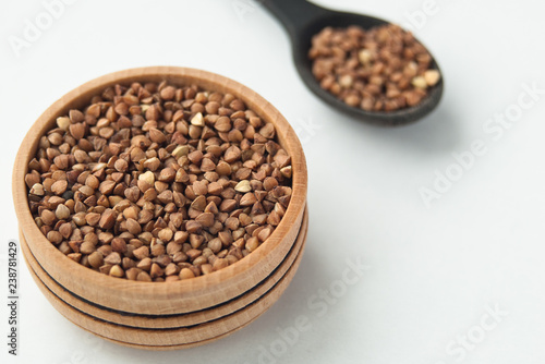 buckwheat seeds in bowl isolated on white