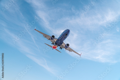 Aviation, travel, air transportation concept. Airplane in blue sky