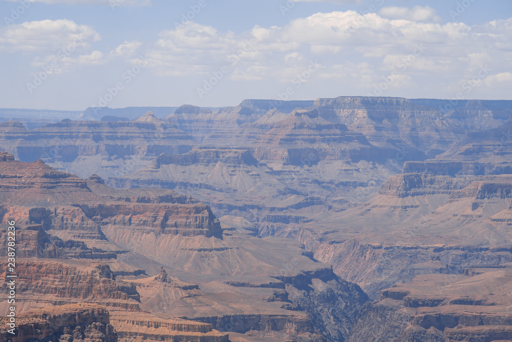 Closeup view on red rocks of Grand Canyon on sunny day