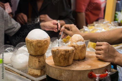 Thai street food : Young Coconut on sale in the market