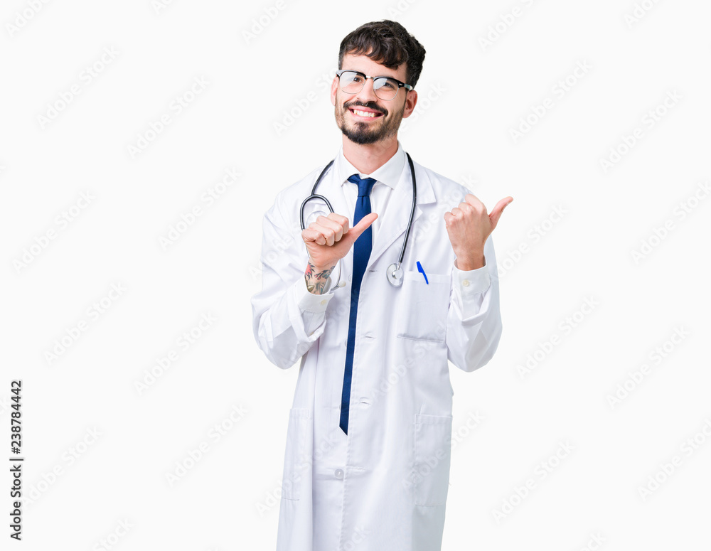 Young doctor man wearing hospital coat over isolated background Pointing to the back behind with hand and thumbs up, smiling confident Young doctor man wearing hospital coat over isolated background Pointing to the back behind with hand and thumbs up, smiling confident