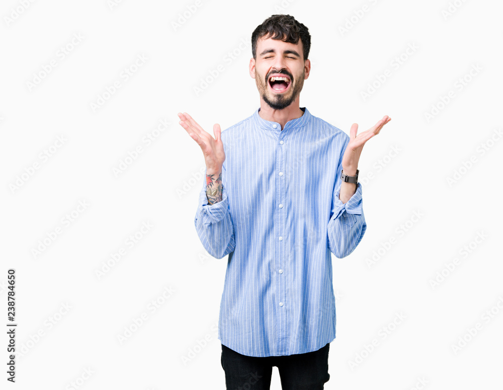 Young handsome business man over isolated background celebrating mad and crazy for success with arms raised and closed eyes screaming excited. Winner concept Young handsome business man over isolated background celebrating mad and crazy for success with arms raised and closed eyes screaming excited. Winner concept