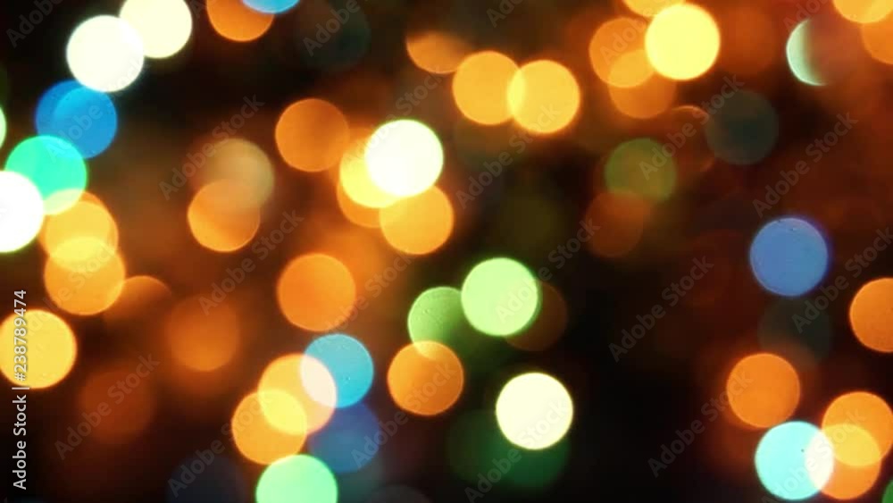 natural bokeh holiday lights background bright lights green yellow blue party city lights of the Christmas tree natural bokeh holiday lights background bright lights green yellow blue party city lights of the Christmas tree