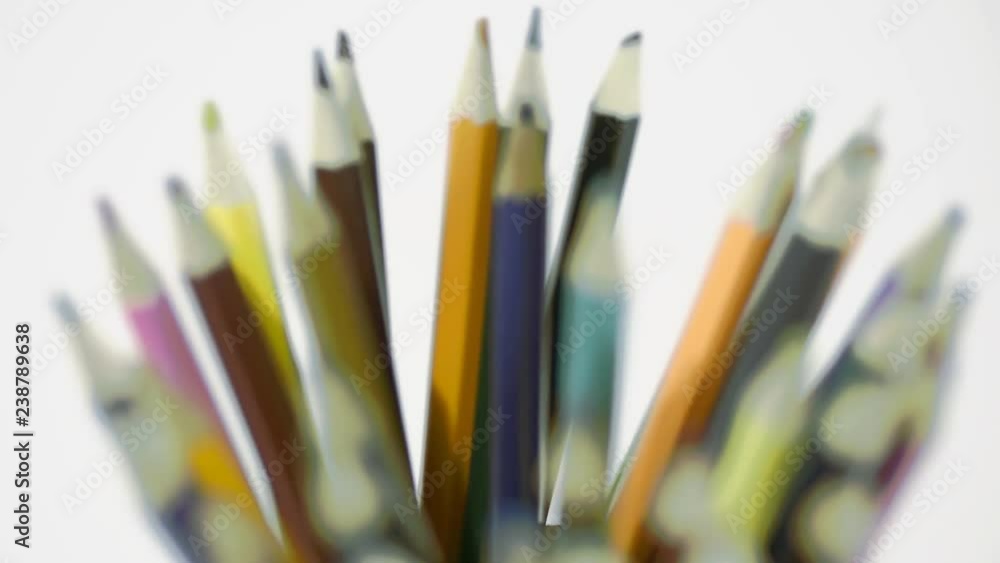 Pencil on a white background. Camera in motion. Pencils are in the glass Pencil on a white background. Camera in motion. Pencils are in the glass