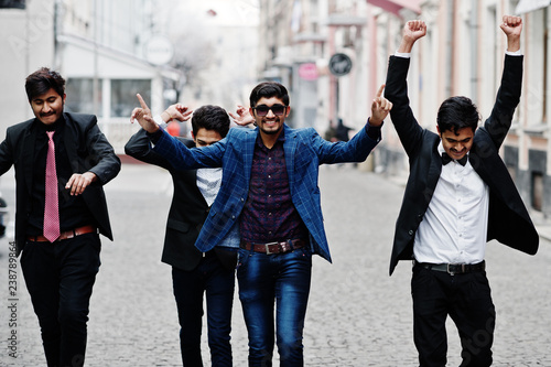 Photography Group of 5 indian students in suits posed outdoor, having fun and dancing