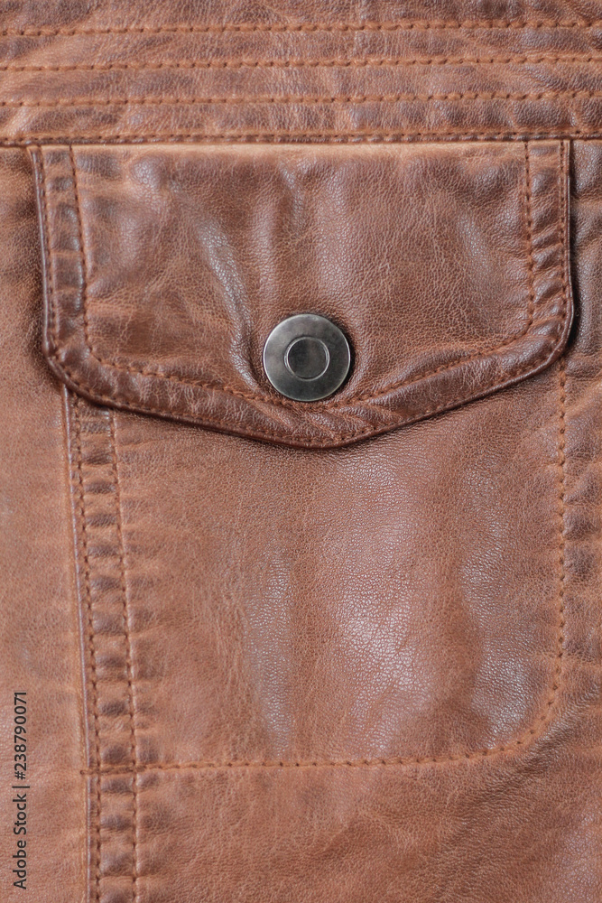 button pocket on old worn leather jacket. background button pocket on old worn leather jacket. background