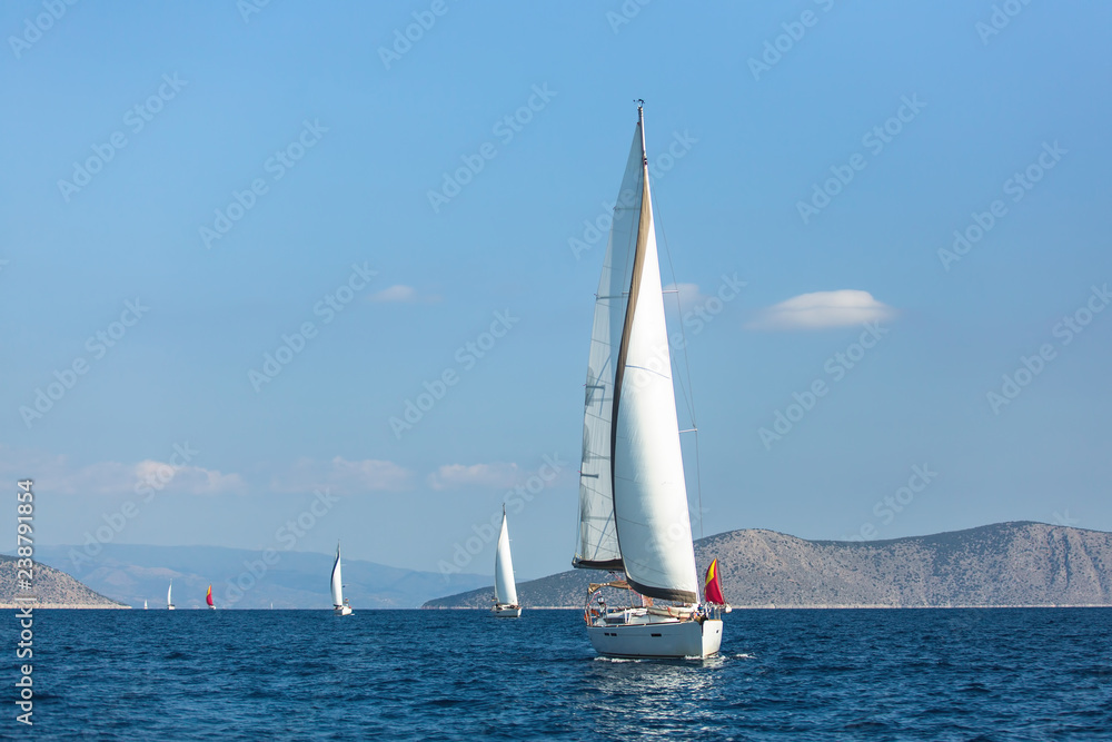 Sailing luxury yacht boats in regatta on the Aegean Sea, Greece.