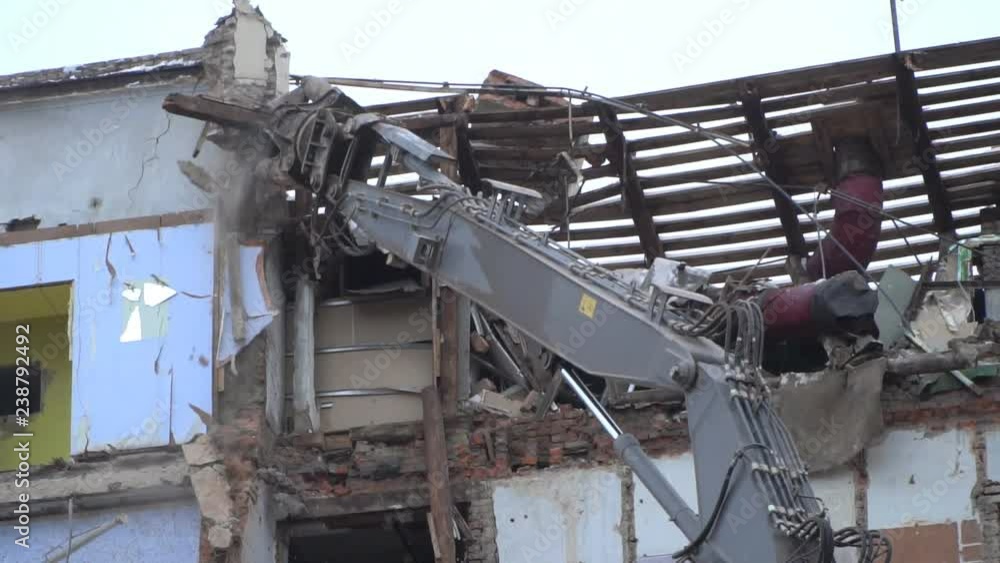 demolition of a multi-storey building with hydraulic shears, for future development of residential buildings demolition of a multi-storey building with hydraulic shears, for future development of residential buildings