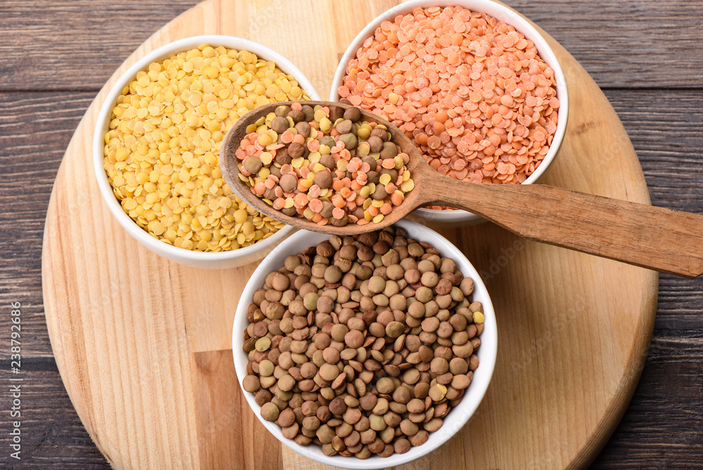 Assorted varieties of lentils on a wooden background Assorted varieties of lentils on a wooden background