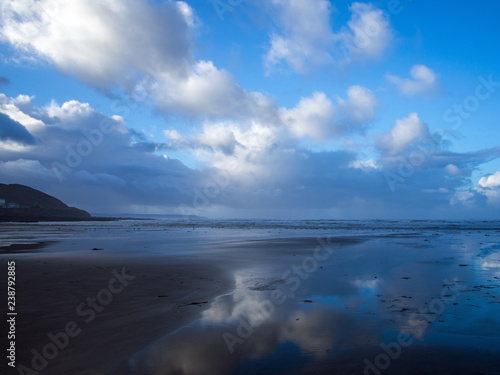 beautiful cloud reflections on the sands of Westward ho beach in Devon ,England