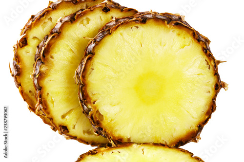 sliced ripe pineapple close up on white background