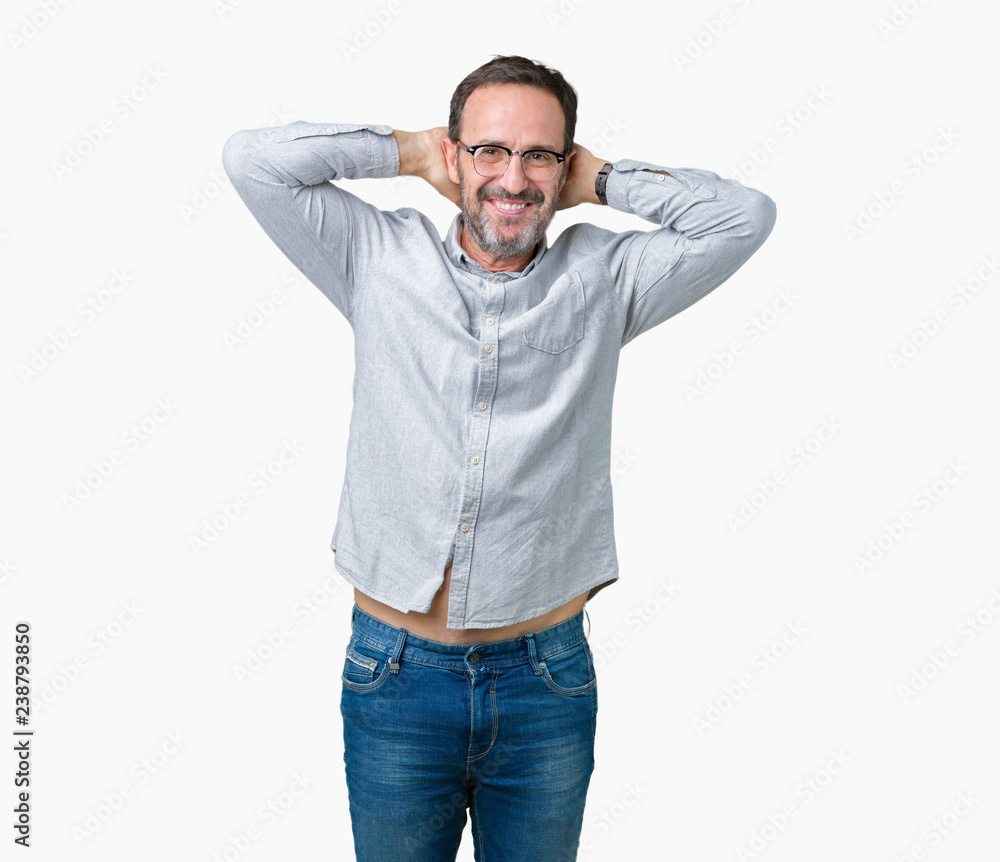 Handsome middle age elegant senior man wearing glasses over isolated background Relaxing and stretching with arms and hands behind head and neck, smiling happy Handsome middle age elegant senior man wearing glasses over isolated background Relaxing and stretching with arms and hands behind head and neck, smiling happy