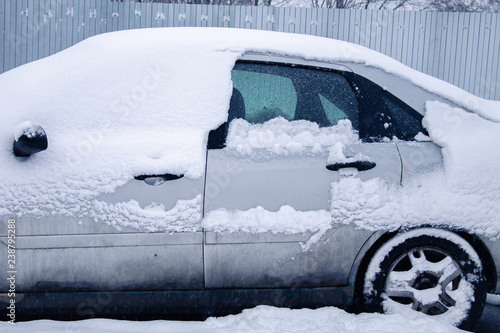 car covered with snow ,car in the snow,car stuck in the snow