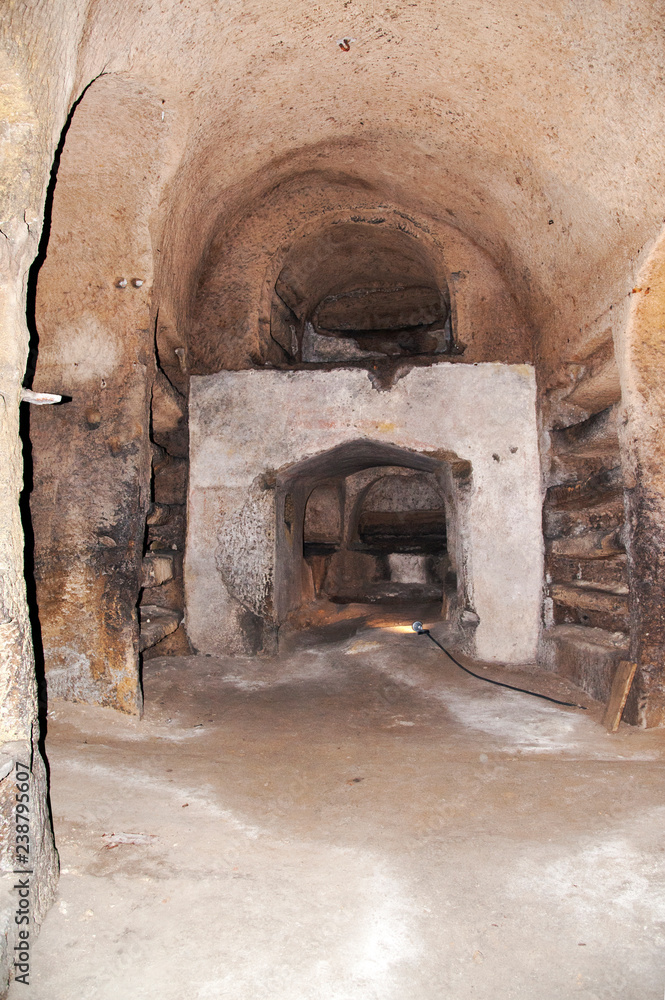 Ancient tombs dug in the tuff rock in the subsoil of Naples (Italy) called catacombs of San Gennaro. Ancient tombs dug in the tuff rock in the subsoil of Naples (Italy) called catacombs of San Gennaro.