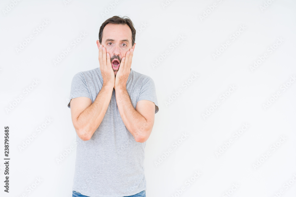 Handsome senior man over isolated background Tired hands covering face, depression and sadness, upset and irritated for problem Handsome senior man over isolated background Tired hands covering face, depression and sadness, upset and irritated for problem
