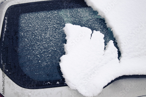 frozen car glass, car glass in ice with snow, frost, snowfall