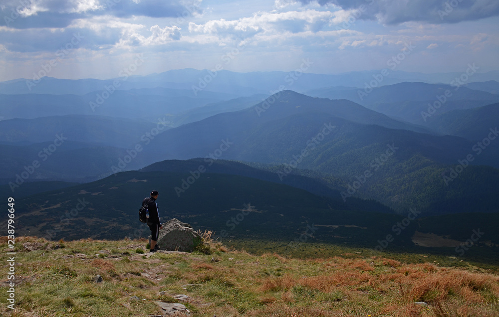 The stone peaks of the mountain ranges of Hoverla Ukrainian Carpathian mountains covered with ancient conifer forests The stone peaks of the mountain ranges of Hoverla Ukrainian Carpathian mountains covered with ancient conifer forests
