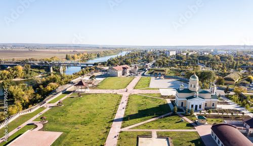 фотографія Aerial view of Orthodox cathedral, Peacekeepers bridge, with Bendery city on riv