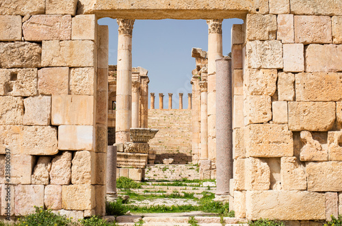 Bild auf Leinwand view to gate in wall to columns and ruins in Jerash city