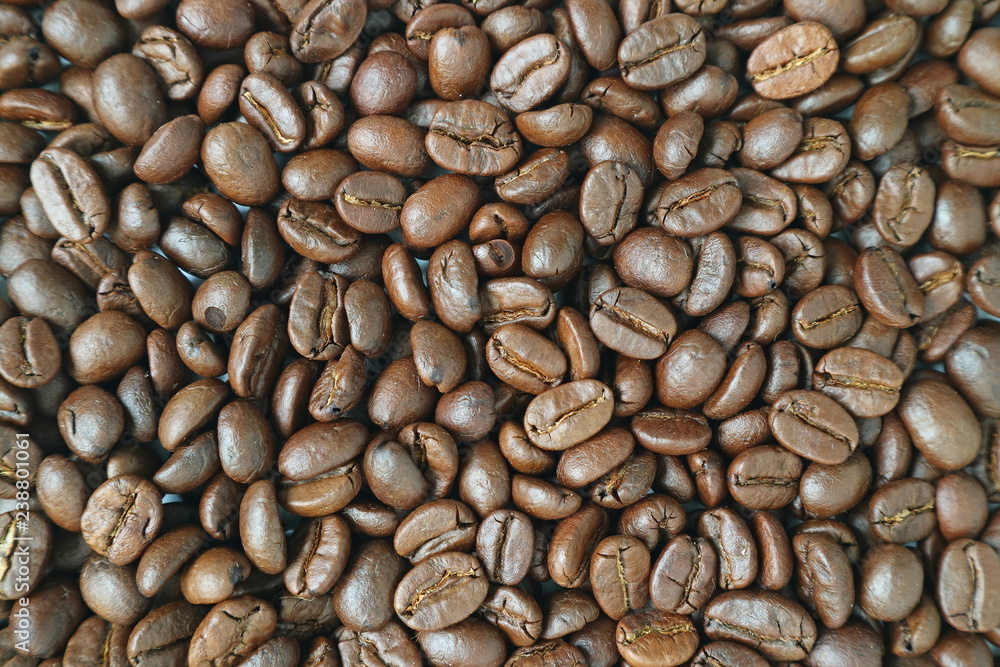 Top view of dark brown aromatic roasted coffee beans for background or banner Top view of dark brown aromatic roasted coffee beans for background or banner