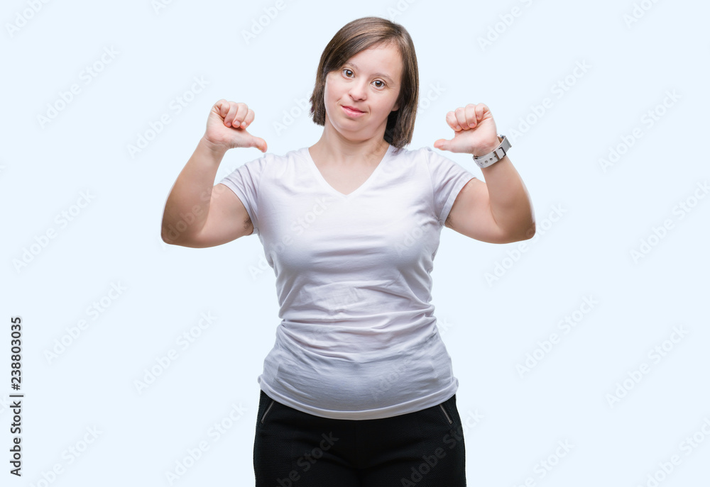 Young adult woman with down syndrome over isolated background looking confident with smile on face, pointing oneself with fingers proud and happy. Young adult woman with down syndrome over isolated background looking confident with smile on face, pointing oneself with fingers proud and happy.