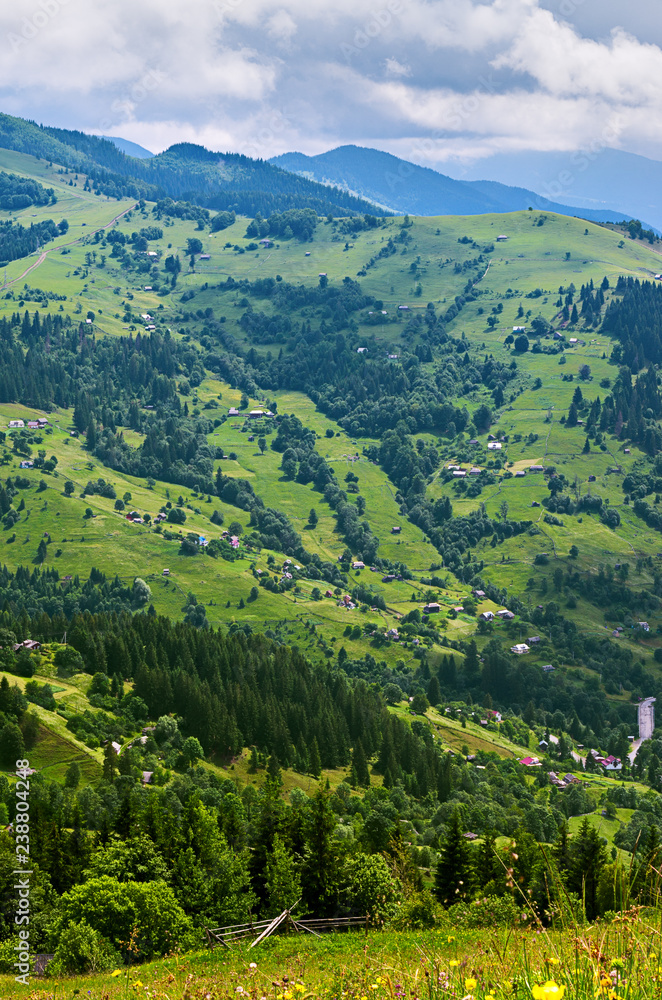 aerial view on mountain slopes with houses. Carpathians Ukraine