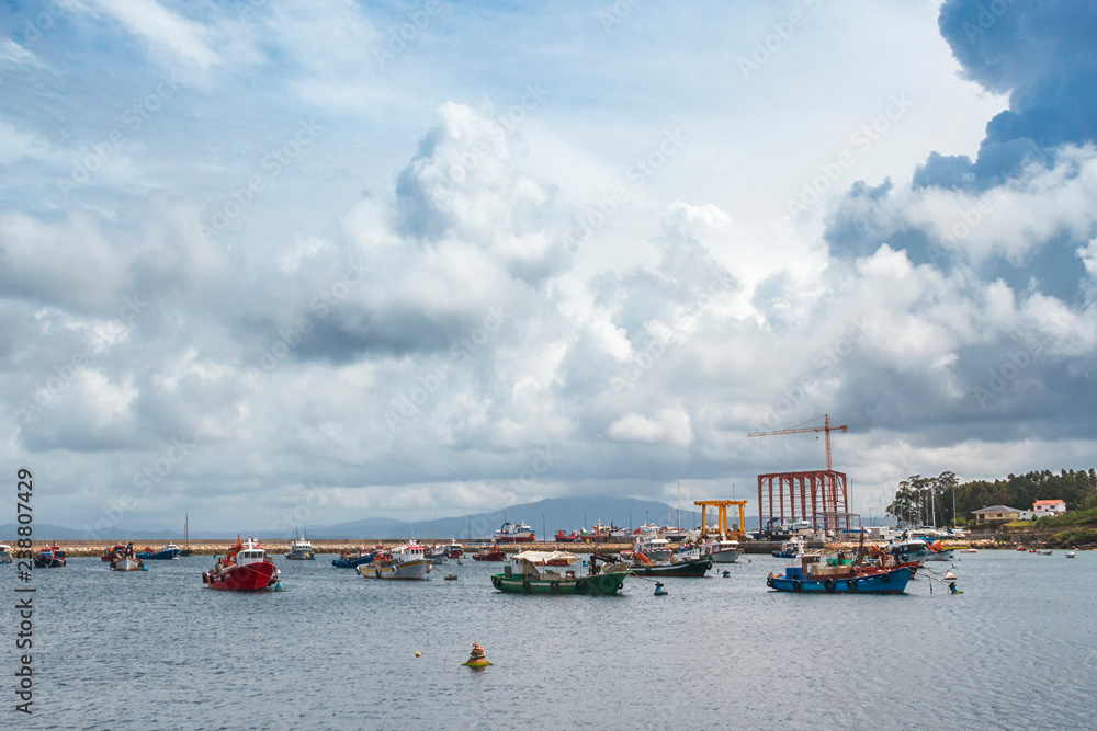 Stormy cumulonimbus in Arousa island fishing harbor - obrazy, fototapety, plakaty 