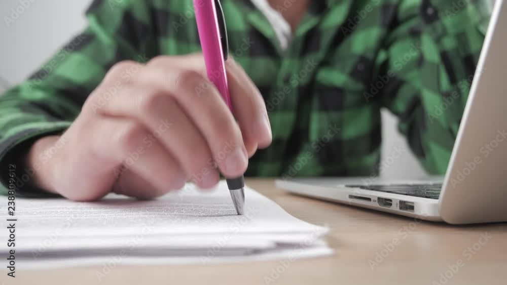 Close up hands of tired businessman waiting for something and makes nervous movements with the pen. Stress at work Close up hands of tired businessman waiting for something and makes nervous movements with the pen. Stress at work