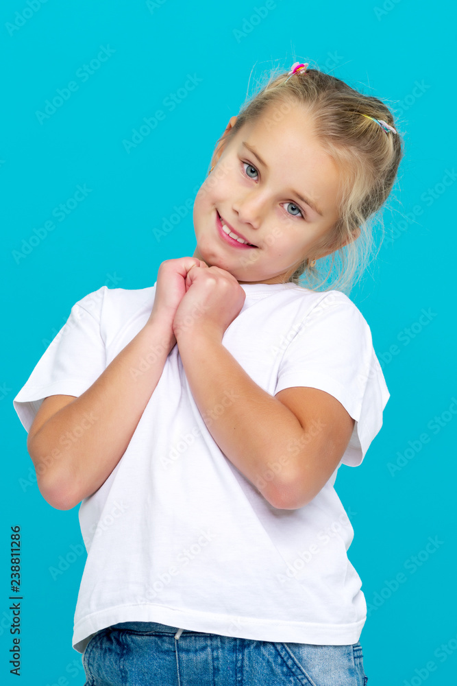 Emotional little girl in a clean white T-shirt. Emotional little girl in a clean white T-shirt.