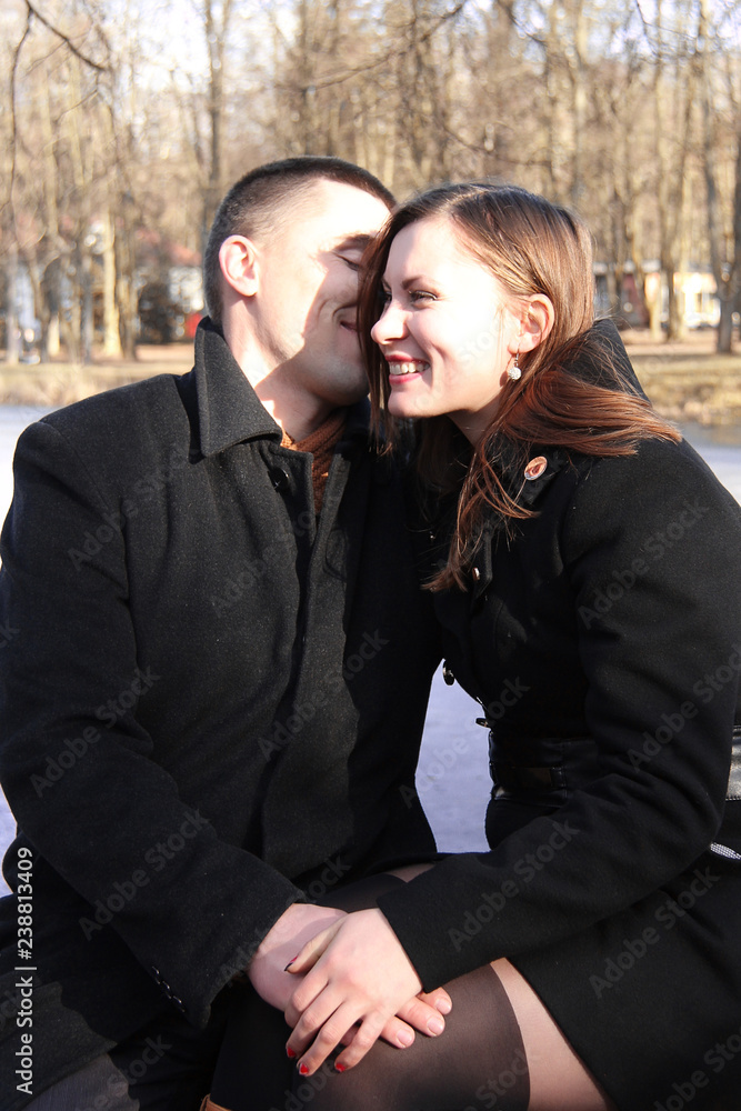 Happy couple in the city park on Valentine's day Happy couple in the city park on Valentine's day