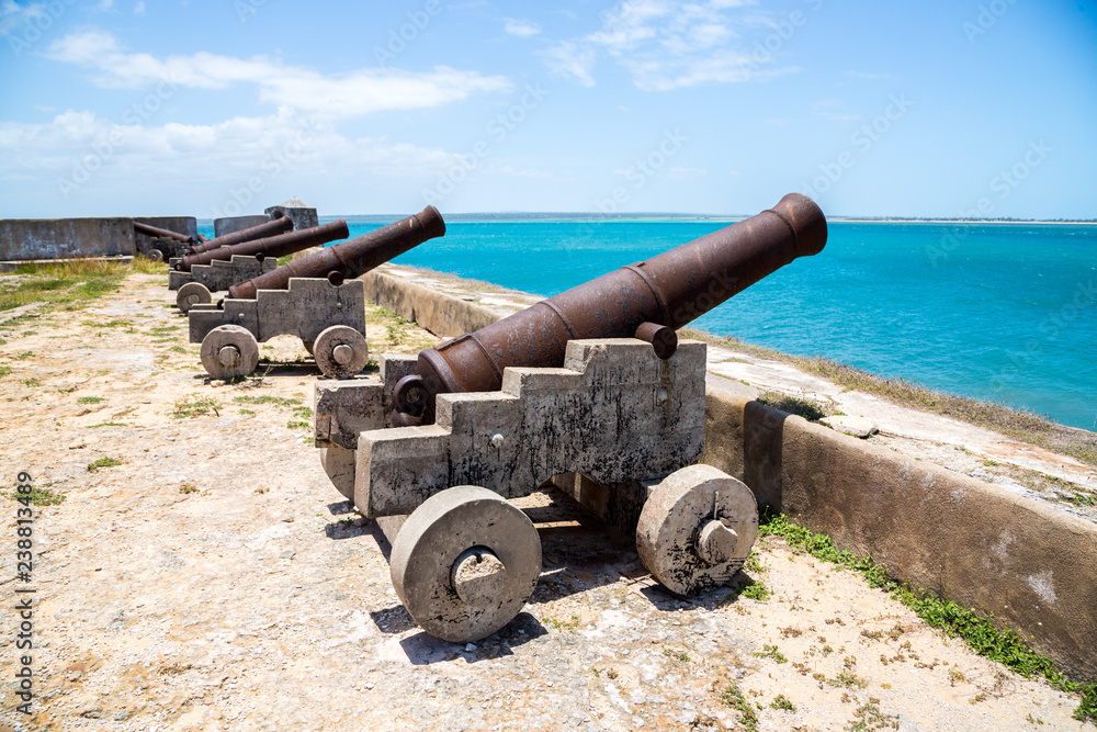 Row of old cannons (guns) of Fort San Sebastian guard Mozambique island (Sao Sebastiao, Ilha de Mocambique), Indian ocean coast, Mozambique. Mossuril Bay, Nampula. Portuguese East Africa