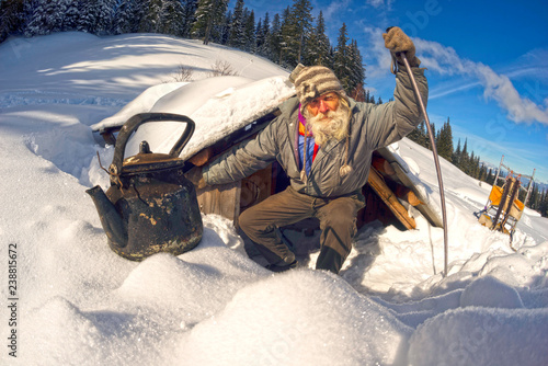 old traveler in the mountains photo