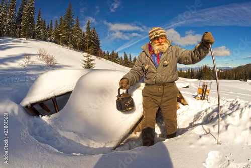 old traveler in the mountains photo