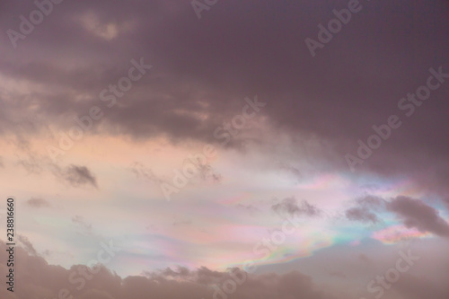 Colorful vibrant sunset sky with rainbow-like effect in the clouds