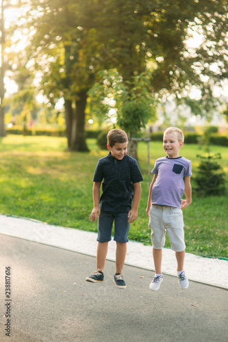 Boys have activity. Children run around and jumt up in the air