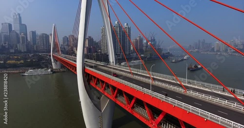 Abstract aerial view of colorful cars trying to navigate through a traffic jam, as two lanes merge at an intersection in Chongqing, urban China.