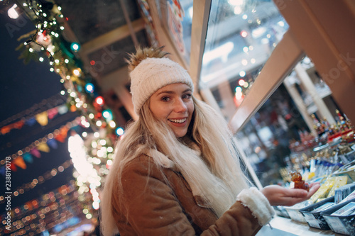 Young woman shopping at New Year Fair