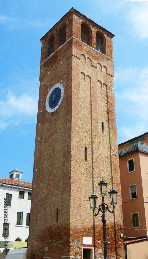 Bell tower of Chioggia with the historical clock of Saint Andrews, Italy