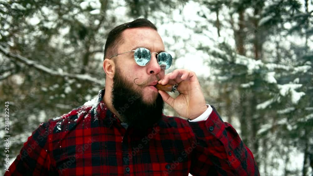 Smoking bearded man. Shallow depth of field. Converted from Raw, rec 709 Smoking bearded man. Shallow depth of field. Converted from Raw, rec 709