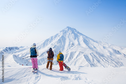 skiers in mountains photo