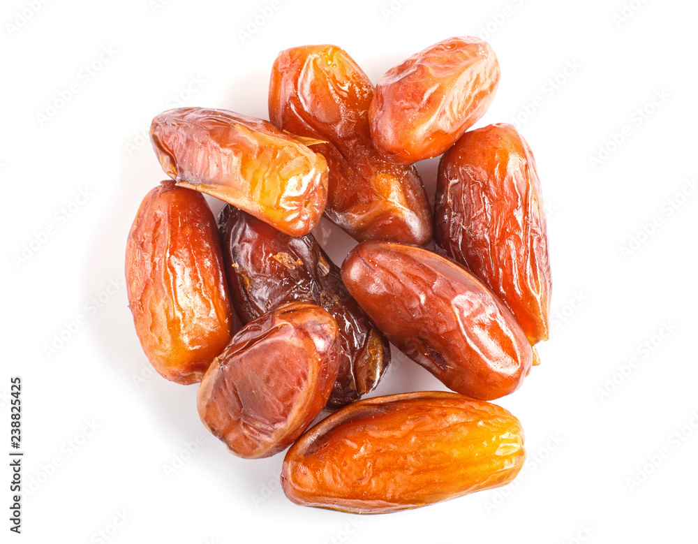Pile of dried dates isolated on white background. Pile of dried dates isolated on white background.