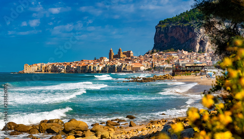Panoramic view of Cefalu city with traditional houses on the seaside in a sunny day on Sicily islands