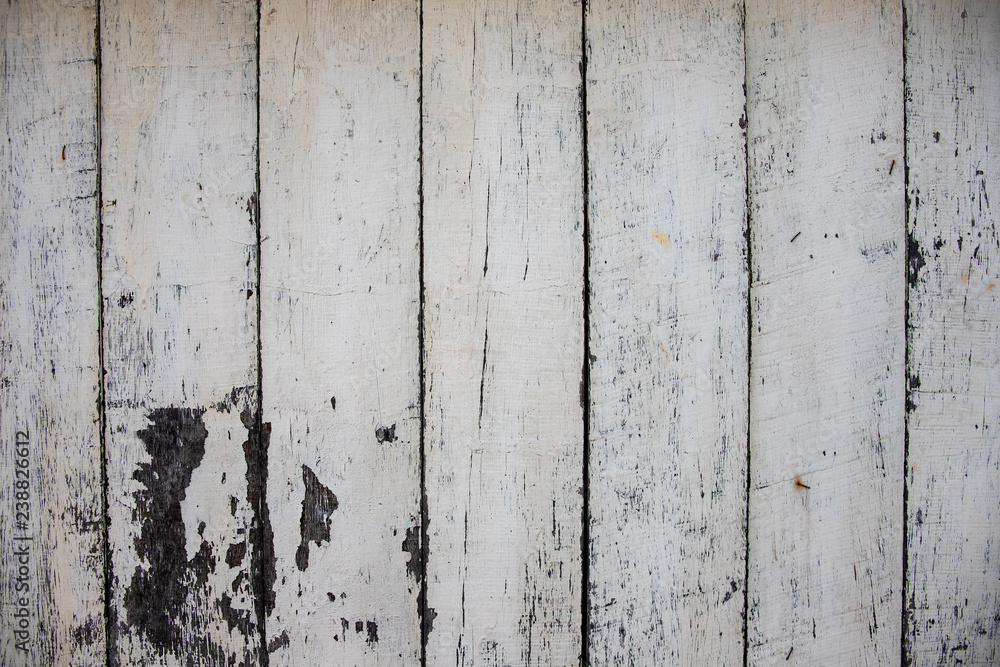 White painted wooden board photo texture. Natural wood background. Distressed rough lumber board. White painted wooden board photo texture. Natural wood background. Distressed rough lumber board.