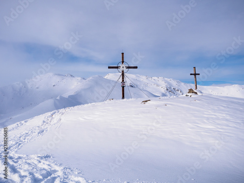 Sybmolic cross on top of mountain