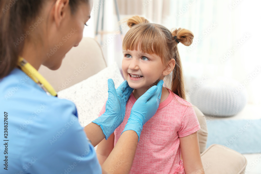 Children's doctor visiting little girl at home Children's doctor visiting little girl at home