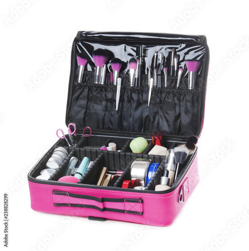 Stylish case with makeup products and beauty accessories on white background
