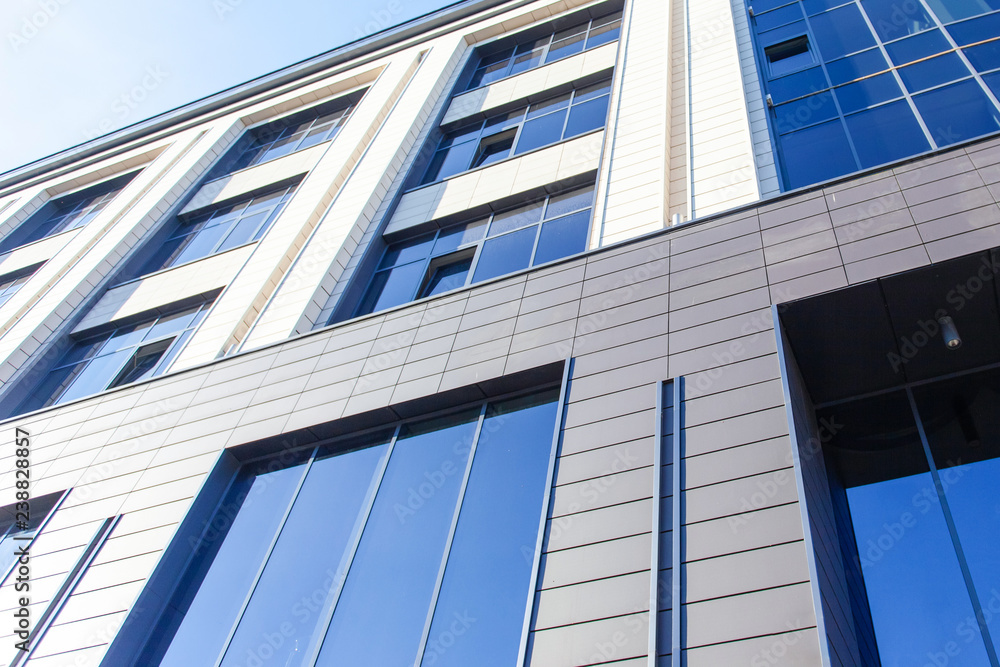 wall with large windows of a modern business building wall with large windows of a modern business building