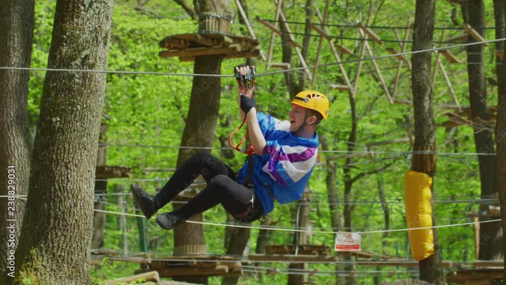 Man descending on a Tyrolean traverse
